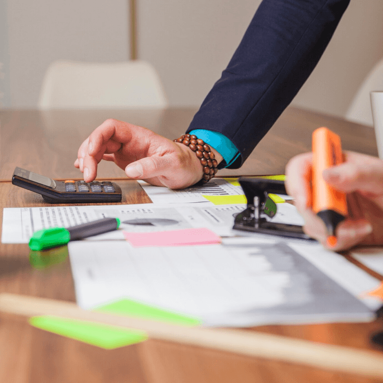 Hand with a calculator